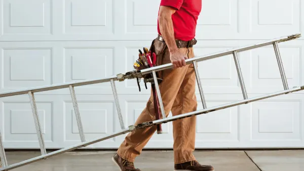 Man carrying a ladder